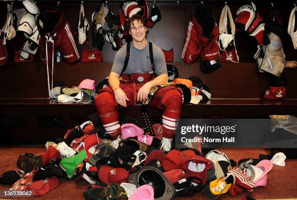 Shane Doan of the Phoenix Coyotes is presented with the hats thrown on the ice after recording his first career NHL hat trick against the New York...