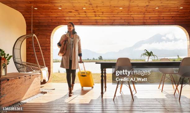 young woman arriving at a holiday home resort for her vacation - luxury travel stock pictures, royalty-free photos & images