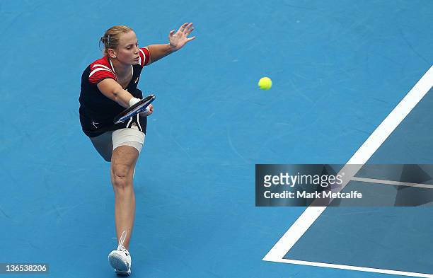Jelena Dokic of Australia plays a forehand in her first round match against Isabella Holland of Australia during day one of the 2012 Sydney...