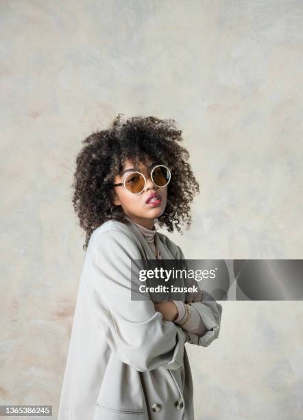 fashion portrait of young woman wearing beige clothes - designer sunglasses stock pictures, royalty-free photos & images