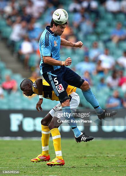 Michael Beauchamp of Sydney FC wins the ball over Bernie Ibini of the Mariners during the round 14 A-League match between Sydney FC and the Central...