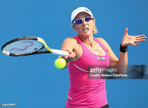 Anastasia Rodionova of Australia plays a forehand in her singles match against Gretta Arn of Hungary during day one of the 2012 Hobart International...