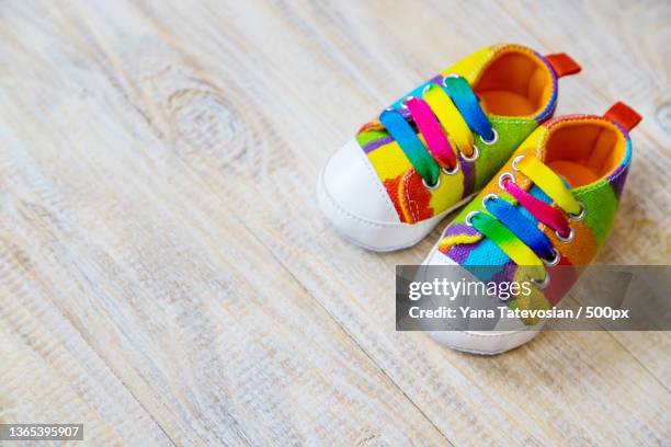baby booties and accessories on a light background selective focus - baby booties stock pictures, royalty-free photos & images