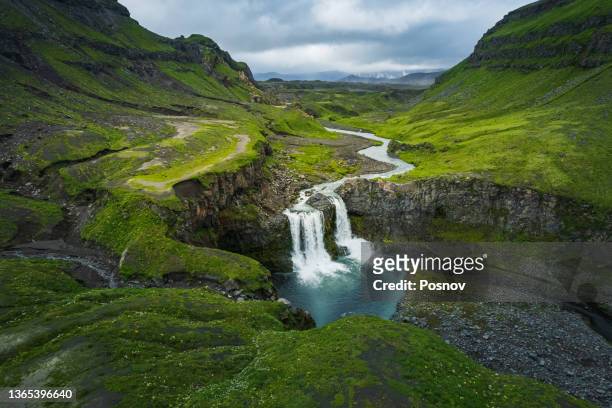 waterfall at the gates of okmok at umnak - alaska location stock pictures, royalty-free photos & images