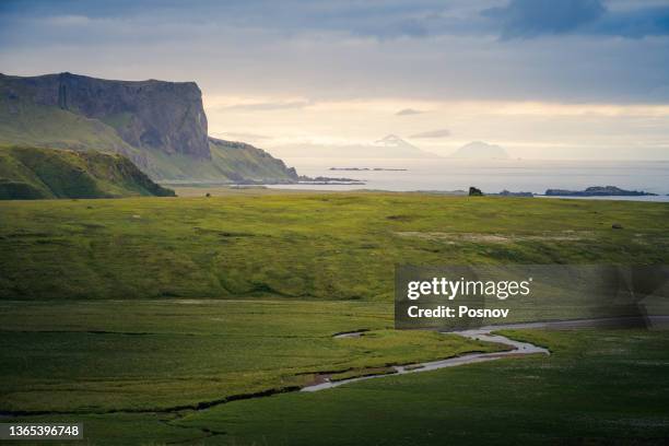 view to unalaska island from umnak - unalaska stock-fotos und bilder