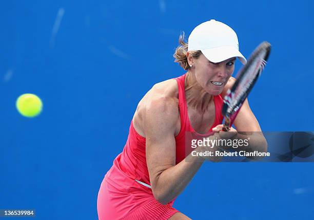 Greta Arn of Hungary plays a backhand in her singles match against Anastasia Rodionova of Australia during day one of the 2012 Hobart International...