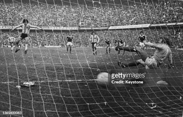 Daniel Passarella of Argentina scores from a penalty kick past the diving Alan Rough, goalkeeper for Scotland during their International Friendly...