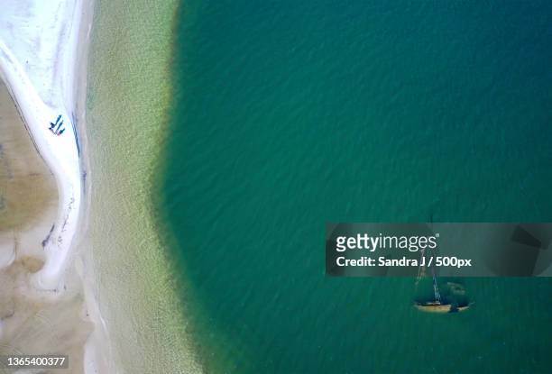 people on a beach drone photo,dauphin island,alabama,united states,usa - gulf shores alabama stock-fotos und bilder