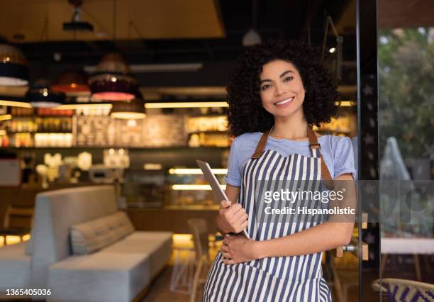 happy waitress working at a restaurant - waiter using digital tablet stock pictures, royalty-free photos & images