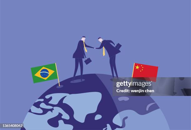 brazilian business men and chinese business men shake hands on the earth and develop together - brazil business stock illustrations