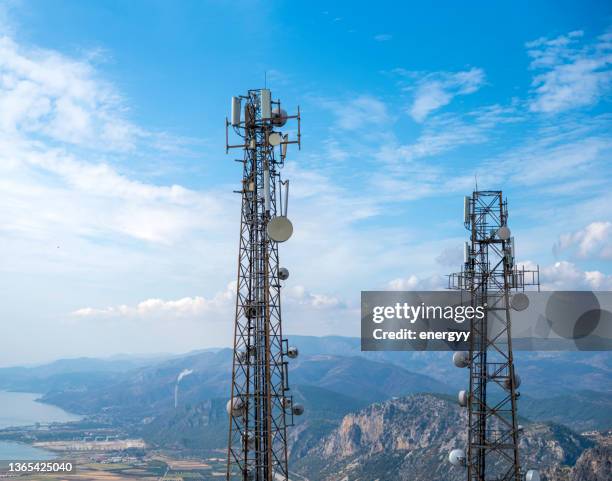 cell phone or mobile service towers - telecommunications tower stock pictures, royalty-free photos & images