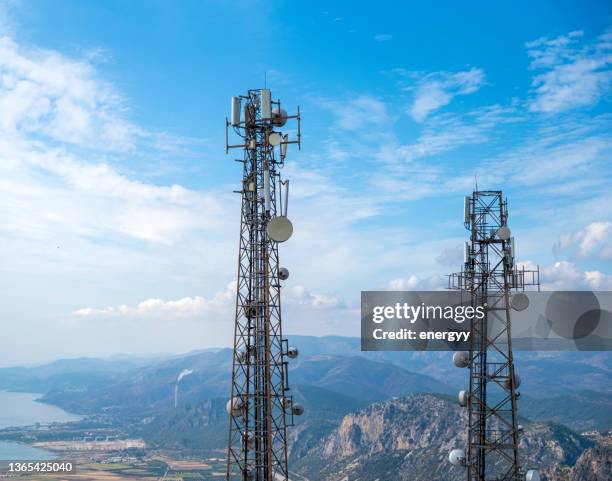 cell phone or mobile service towers - broadband internet stock pictures, royalty-free photos & images