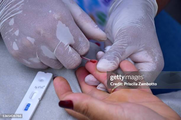 rapid test for aids, syphilis and hepatitis - job aids stock pictures, royalty-free photos & images