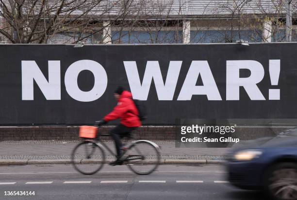 Billboard hanging outside a night club reads: "No War!" on January 18, 2022 in Berlin, Germany. Tensions between Europe, Ukraine and the U.S. On the...