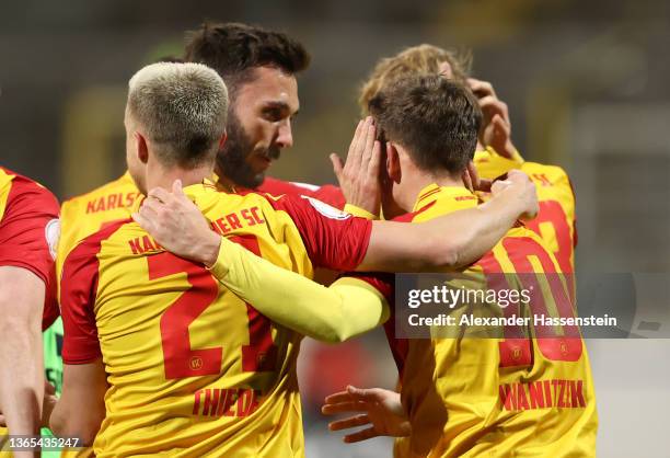 Marvin Wanitzek of Karlsruher SC celebrates with team mates after scoring their team's first goal during the DFB Cup round of sixteen match between...