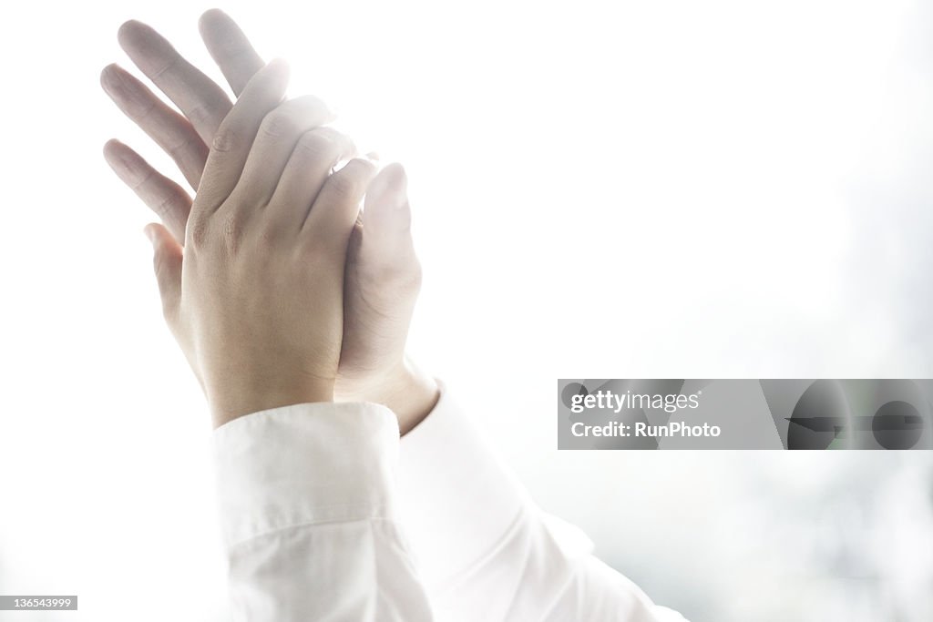 Stacking hands,close-up