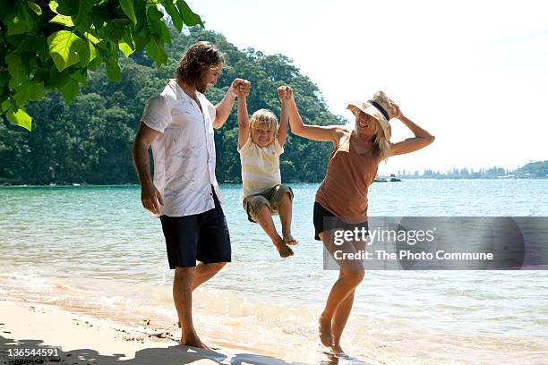 australian family at the beach - beach fun stock pictures, royalty-free photos & images