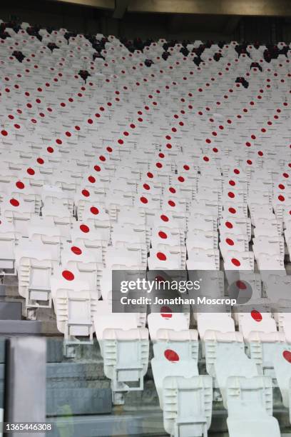 Empty seating is seen following the government's regulation to reduce the number of attendees to games to combat the Covid-19 pandemic during the...