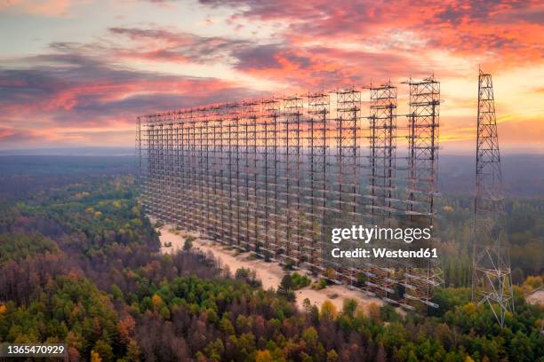 ukraine,kyivoblast, chernobyl, aerial view of remains of russian woodpecker radar at sunset - ukraine landscape stock-fotos und bilder