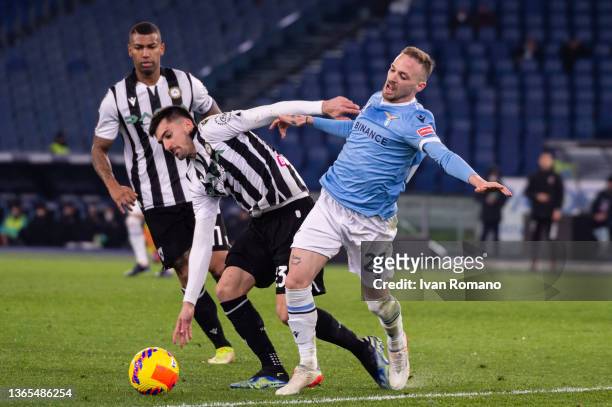 Manuel Lazzari of SS Lazio and Ignacio Pussetto of Udinese Calcio compete for the ball during the Coppa Italia match between SS Lazio and Udinese...