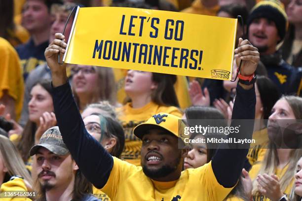 West Virginia Mountaineers fan holds up a sign during a college basketball game against the Baylor Bears at the WVU Coliseum on January 18, 2022 in...