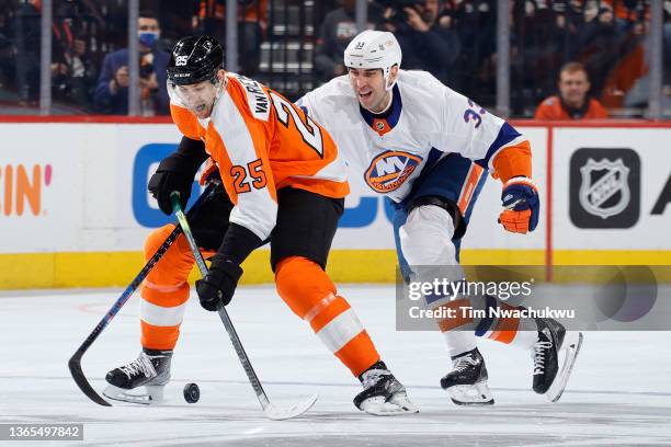 James van Riemsdyk of the Philadelphia Flyers skates with the puck as Zdeno Chara of the New York Islanders defends during the second period at Wells...