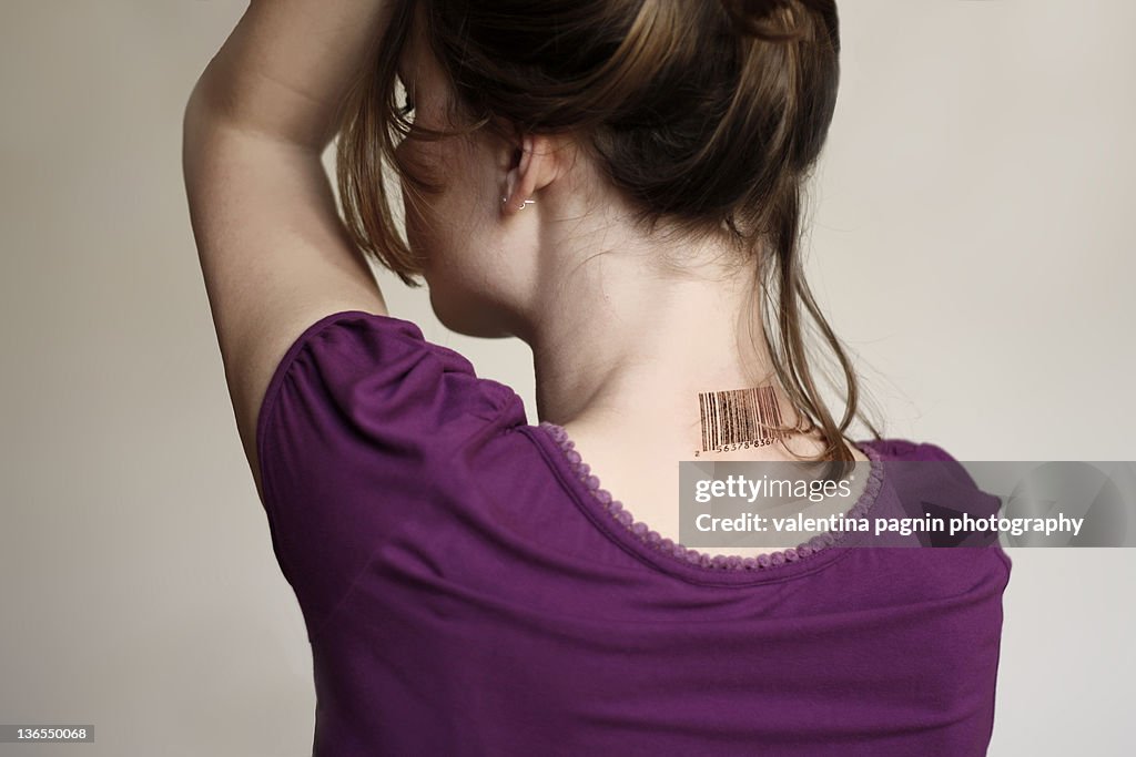 Bar code on girl back neck