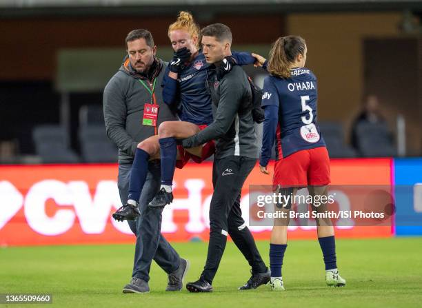 Tori Hunter of the Washington Spirit is carried off the field during a game between North Carolina Courage and Washington Spirit at Audi Field on...