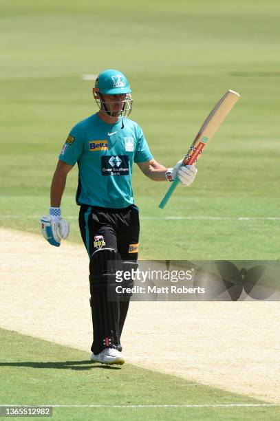 Chris Lynn of the Heat celebrates reaching 3000 BBL runs during the Men's Big Bash League match between the Brisbane Heat and the Sydney Sixers at...