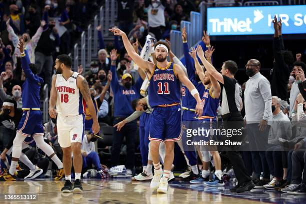 Klay Thompson of the Golden State Warriors reacts after he made a three-point basket over Cory Joseph of the Detroit Pistons at the end of the first...