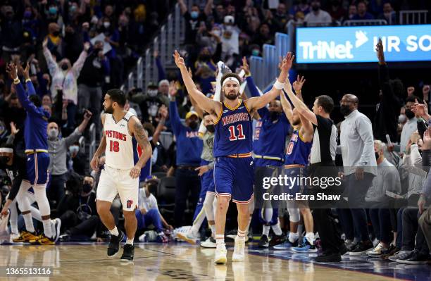 Klay Thompson of the Golden State Warriors reacts after he made a three-point basket over Cory Joseph of the Detroit Pistons at the end of the first...