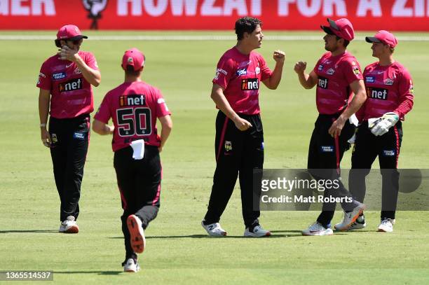 Ben Dwarshuis of the Sixers celebrates the wicket of Marnus Labuschagne of the Heat during the Men's Big Bash League match between the Brisbane Heat...