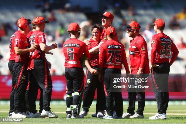 Cameron Boyce of the Renegades celebrates with teammates after dismissing Daniel Sams of the Thunder during the Men's Big Bash League match between...