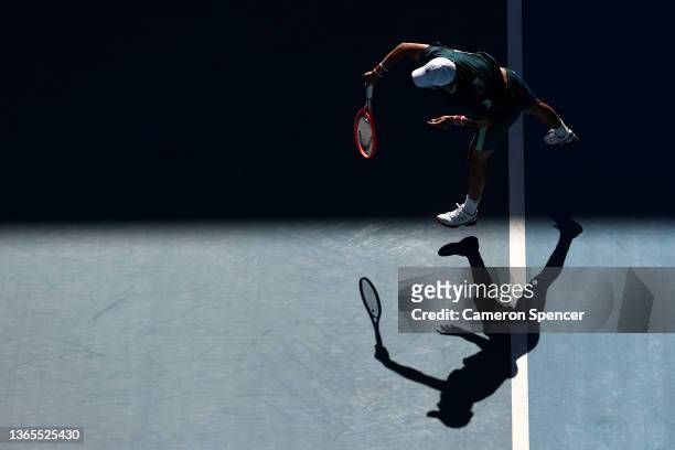 Soonwoo Kwon of South Korea serves in his second round singles match against Denis Shapovalov of Canada during day three of the 2022 Australian Open...