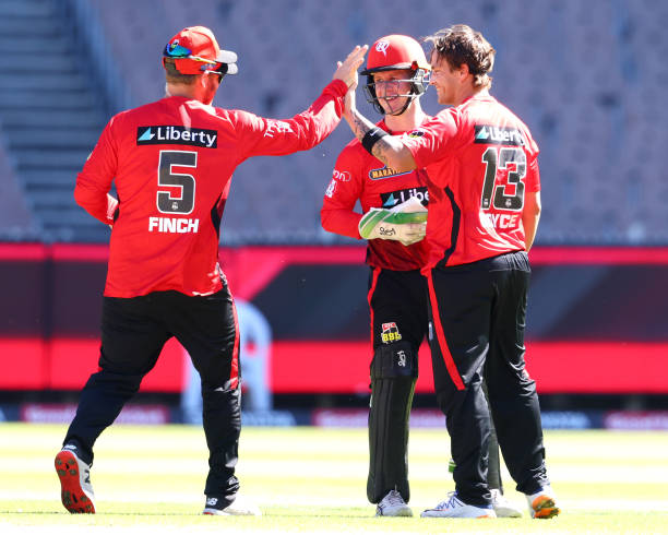 Aaron Finch of the Renegades congratulates Cameron Boyce of a wicket during the Men's Big Bash League match between the Sydney Thunder and the...