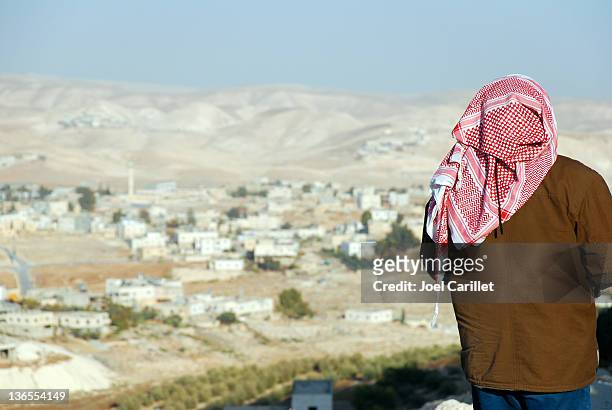 palestinian man looking at west bank landscape from the herodian - historical palestine 個照片及圖片檔