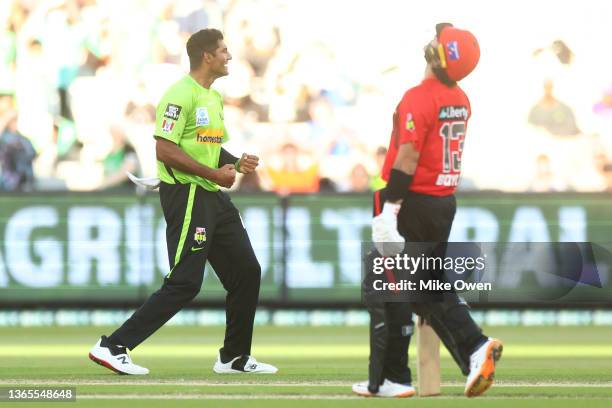 Gurinder Sandhu of the Thunder celebrates after dismissing Cameron Boyce of the Renegades and winning the Men's Big Bash League match between the...