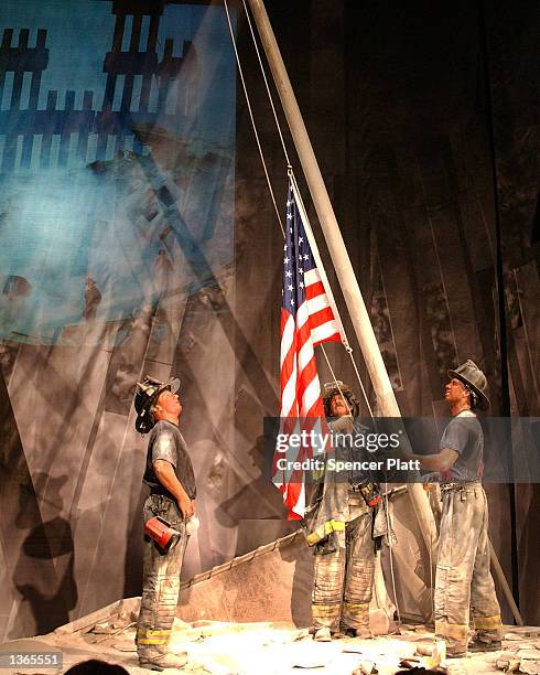 Wax replica of Thomas Franklin's photograph from September 11, is seen at Madame Tussaud's wax museum September 3, 2002 in New York City. The replica...