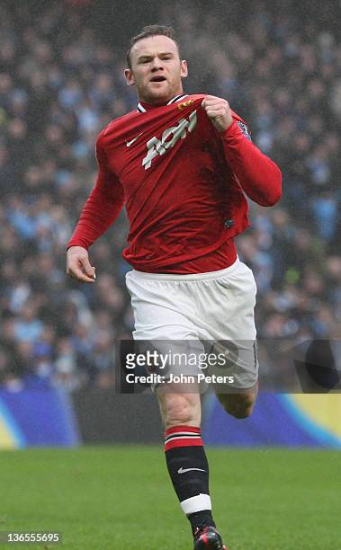 Wayne Rooney of Manchester United celebrates scoring their first goal during the FA Cup Third Round match between Manchester City and Manchester...