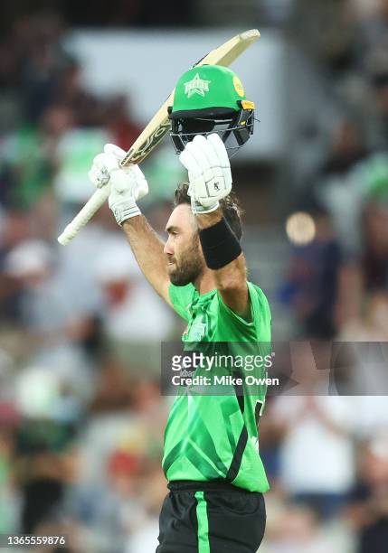 Glenn Maxwell of the Stars raises his bat after scoring a century during the Men's Big Bash League match between the Melbourne Stars and the Hobart...