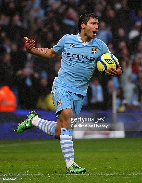 Sergio Aguero of Manchester City celebrates scoring his team's second goal during the FA Cup Third Round match between Manchester City and Manchester...