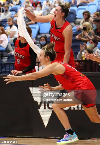 Lauren Scherf of the Lynx and Marina Mabrey of the Lynx celebrate in the final minutes during the round eight WNBL match between Perth Lynx and...