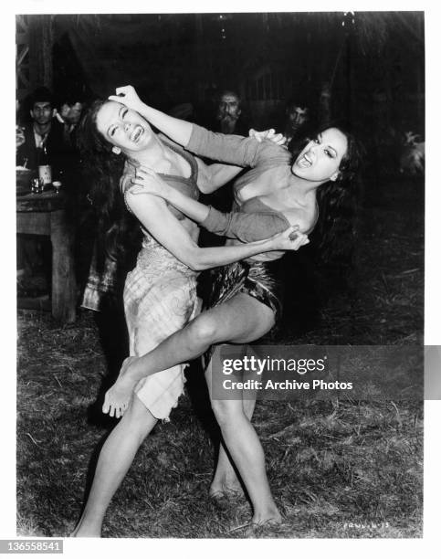 Two gypsy woman fight in sarongs in a scene from the film 'James Bond: From Russia With Love', 1963.
