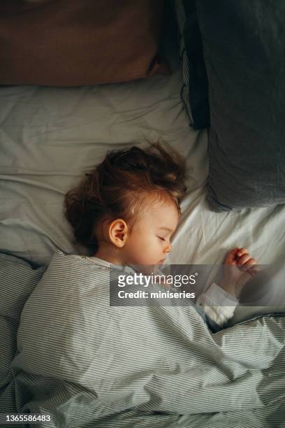 top view shot of a baby girl having a nap - sleeping toddler bed stock pictures, royalty-free photos & images