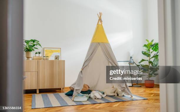 grey teepee tent in the playroom - teepee inside stock pictures, royalty-free photos & images