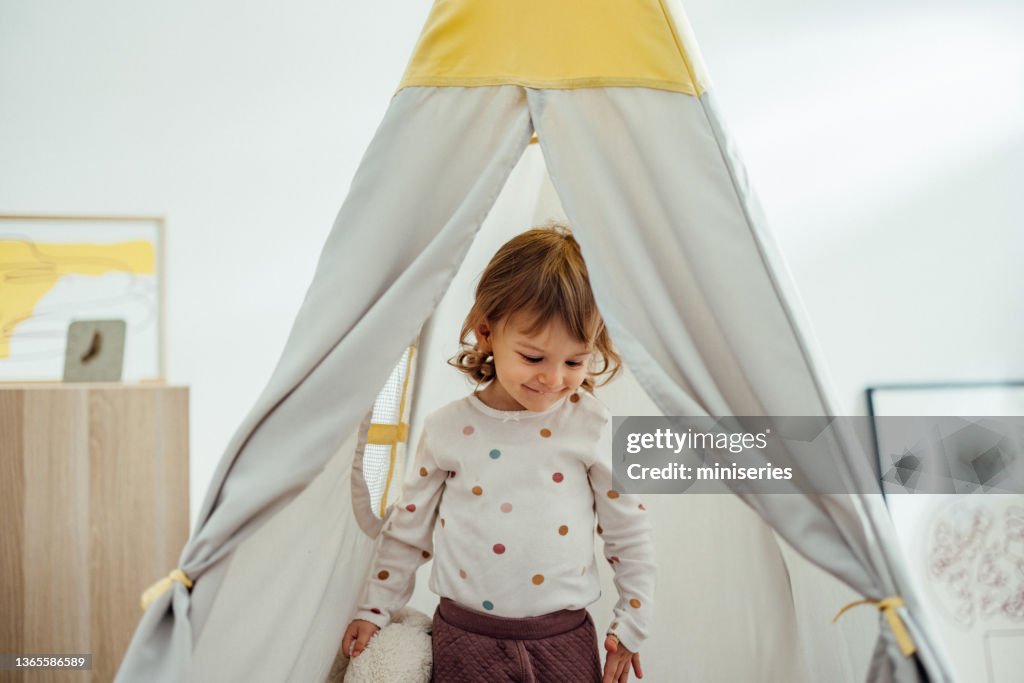 Adorable Girl Playing in the Teepee Tent at Home
