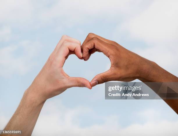 hands making a heart shape - two hearts fotografías e imágenes de stock