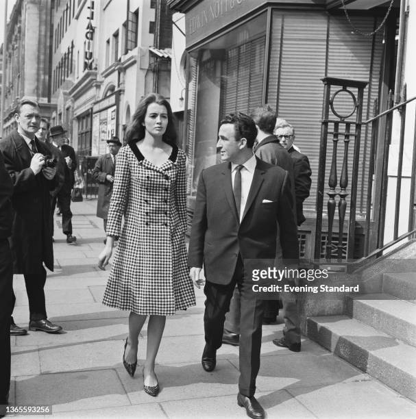 English model Christine Keeler with her solicitor in central London, UK, 26th April 1963. She has accused jazz singer 'Lucky' Gordon of attacking her...