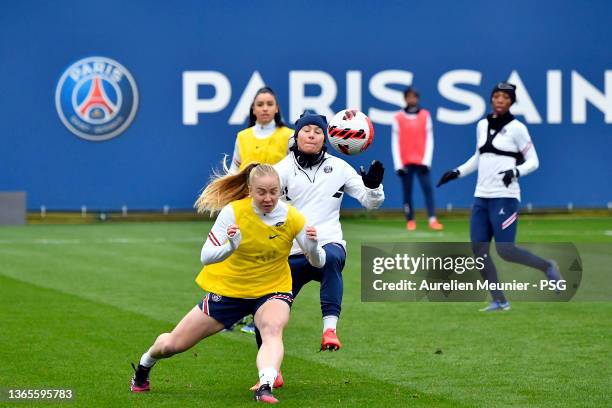 Ramona Bachmann and Paulina Dudek fight for possession during a Paris Saint-Germain Women training session on January 19, 2022 in Paris, France.