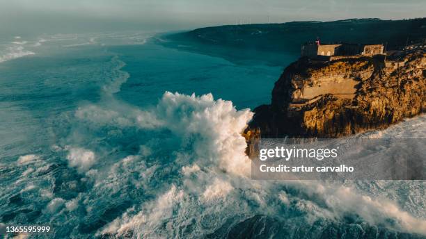 nazaré big waves in the landscape of portugal atlantic coast - portugal bildbanksfoton och bilder